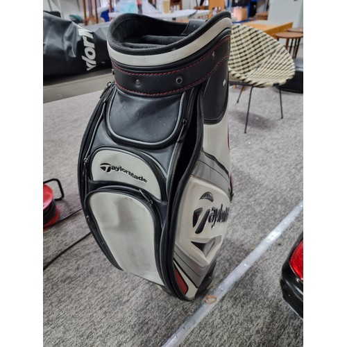 39 - A good quality Taylormade golf bag complete with waterproof hood and carrying strap, in good overall... 