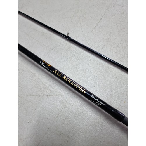 31 - Good quality 2 piece TF Gear all rounder fishing rod in good order with cork handle.