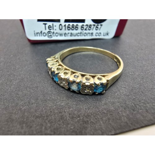 248 - A stunning hallmarked 9ct yellow gold 7 stone ring inset with 4 large round cut blue spinel gemstone... 