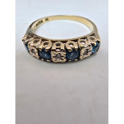 248 - A stunning hallmarked 9ct yellow gold 7 stone ring inset with 4 large round cut blue spinel gemstone... 