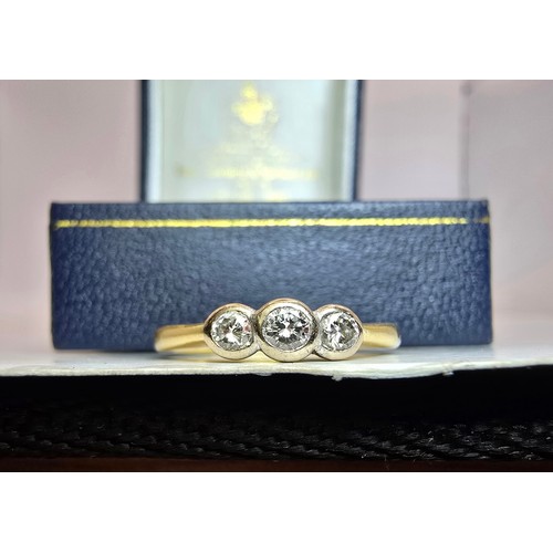 250 - A stunning hallmarked 18ct yellow gold 3 stone diamond ring, the diamonds are very sparkly and livel... 