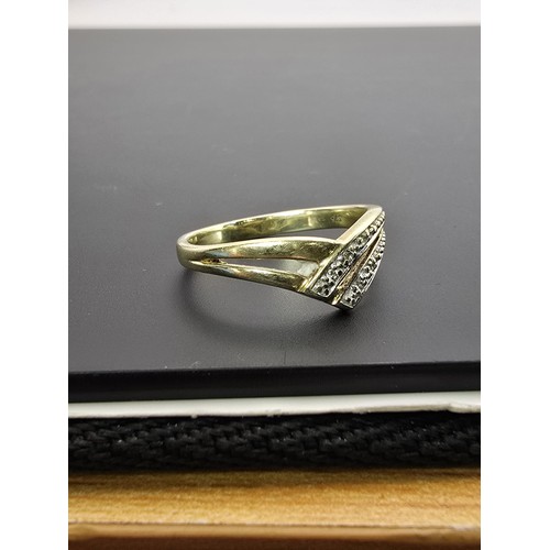 251 - A pretty 9ct yellow gold diamond wishbone ring inset with 5 small diamonds with a total combined wei... 