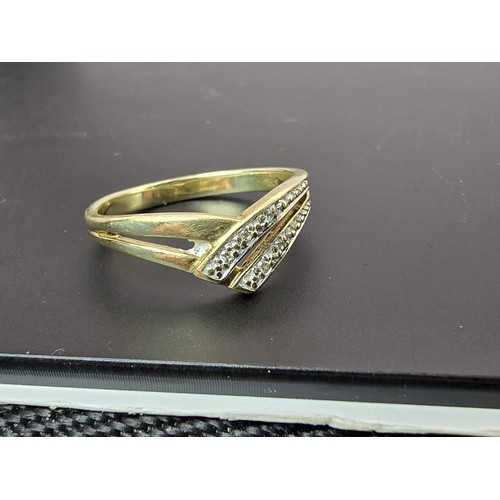 251 - A pretty 9ct yellow gold diamond wishbone ring inset with 5 small diamonds with a total combined wei... 