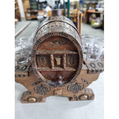 4 - Good quality small wooden liqueur set consisting of a wooden barrel on a wooden carved platform with... 