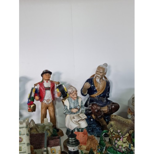 12 - A shelf containing a quantity of collectables including a quantity of miniature well detailed house ... 