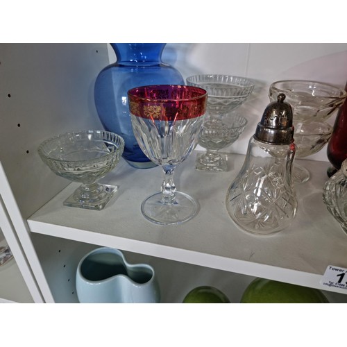 13 - 2 shelves of collectables including a silver tipped cut glass sugar sifter, a pair of cranberry glas... 