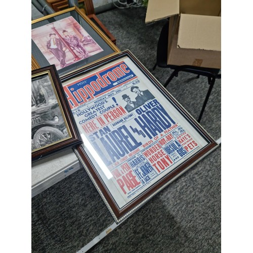 21 - A large collection of Laurel and Hardy collectables including an reproduction advertising poster for... 