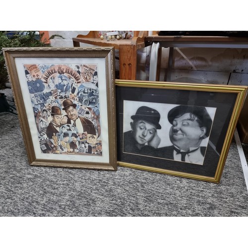 21 - A large collection of Laurel and Hardy collectables including an reproduction advertising poster for... 