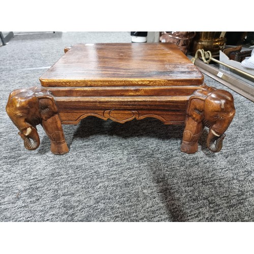 27 - Good quality solid wooden carved elephant heads accent table in good order with heart scrolling arou... 