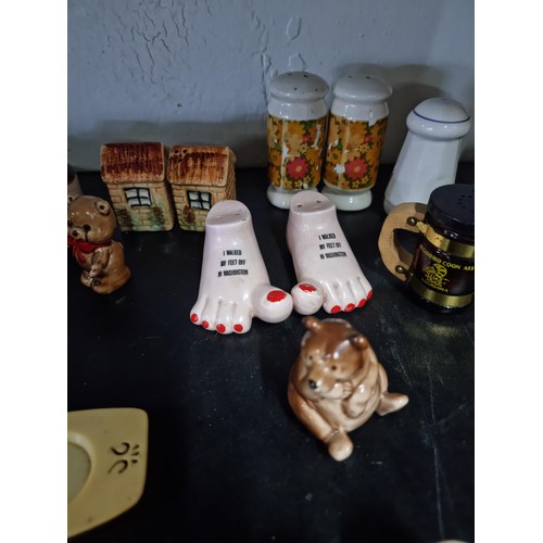 35 - Large quantity of salt and peppers sets mostly are souvenirs from america  inc feet formed set for W... 