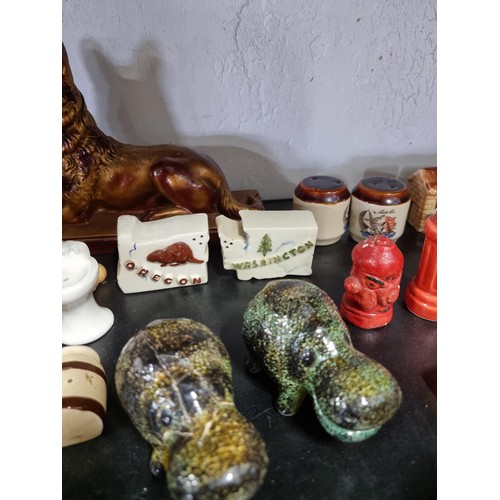 35 - Large quantity of salt and peppers sets mostly are souvenirs from america  inc feet formed set for W... 