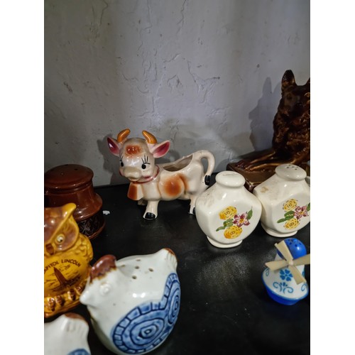 35 - Large quantity of salt and peppers sets mostly are souvenirs from america  inc feet formed set for W... 