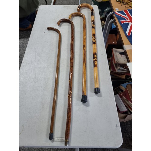 39 - Quantity of 4x good quality wooden hand made walking sticks all have been varnished one with a scorc... 