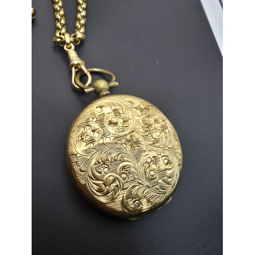 256 - A very pretty ornate gold plated fob locket set with a very long antique 60