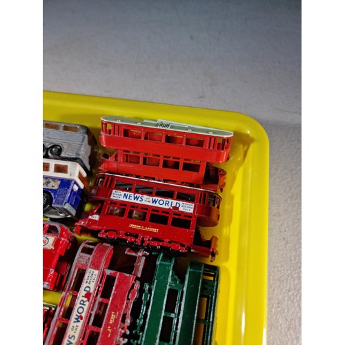 67 - Small tray containing a quantity of 14x Trams and buses, some with advertising inc Ty-Phoo Tea, News... 