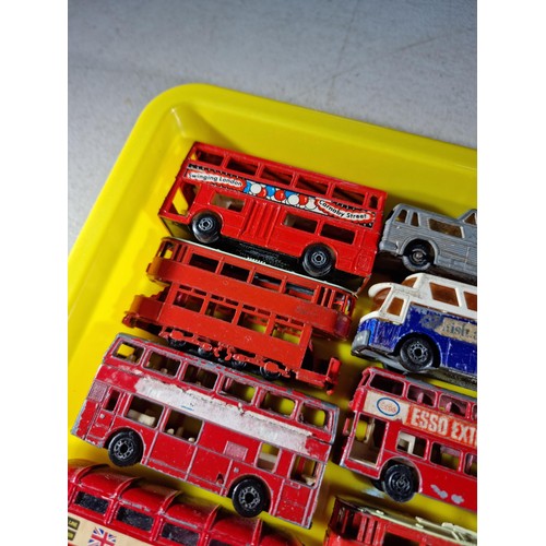 67 - Small tray containing a quantity of 14x Trams and buses, some with advertising inc Ty-Phoo Tea, News... 