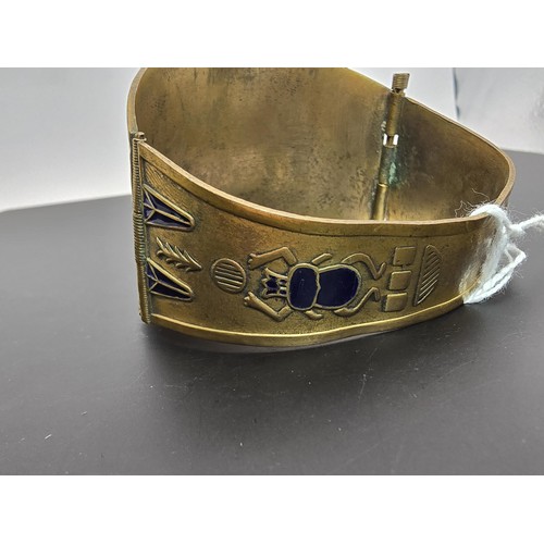 260 - A good quality rare vintage Egyptian revival brass and enamel hinged cuff bangle featuring a stunnin... 