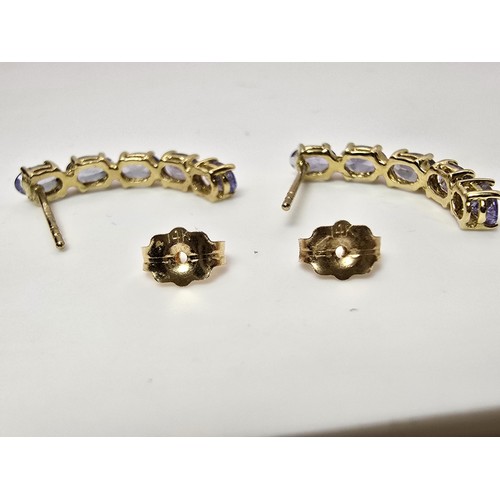 261 - A fine quality pair of 14ct yellow gold stud drop earrings, each earring is inset with 5 stunning na... 