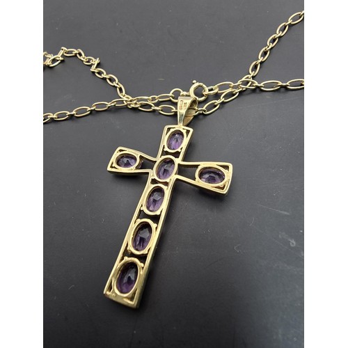 257 - A very pretty hallmarked 9ct yellow gold Cross pendant inset with 7 large faceted amethyst gemstones... 