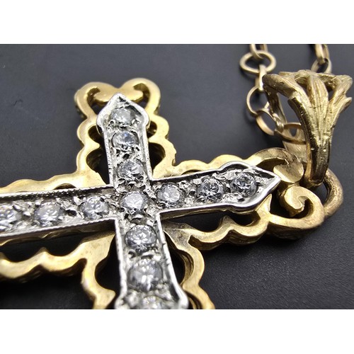 258 - An ornate pretty hallmarked 9ct yellow old Cross pendant inset with a quantity of sparkly crystal st... 