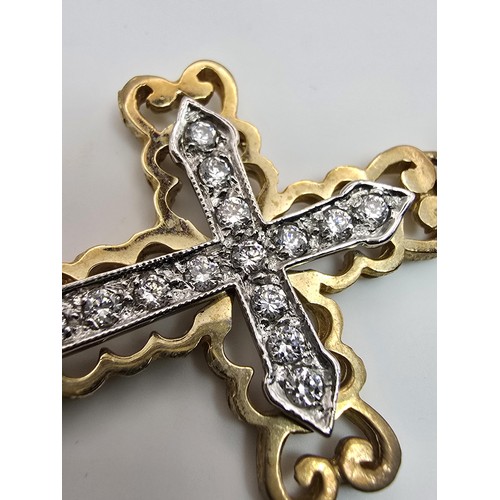 258 - An ornate pretty hallmarked 9ct yellow old Cross pendant inset with a quantity of sparkly crystal st... 