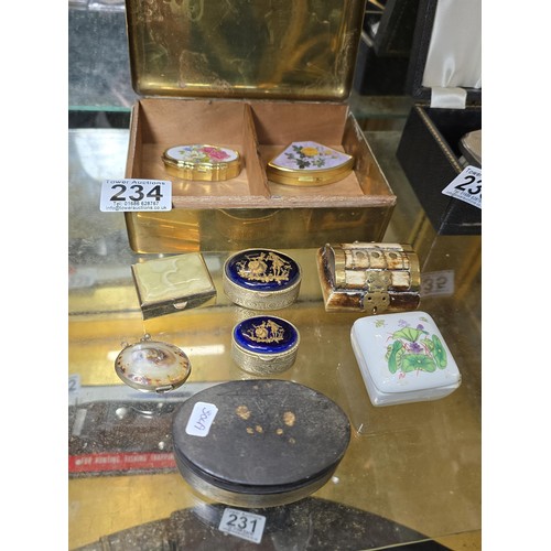 234 - A collection of various ornate pill boxes and trinket boxes all fitted in a good antique solid brass... 