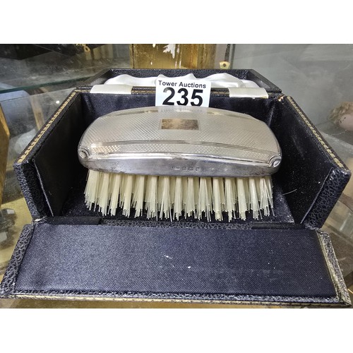 235 - A good quality hallmarked silver backed grooming brush fitted in its original case, the silver brush... 