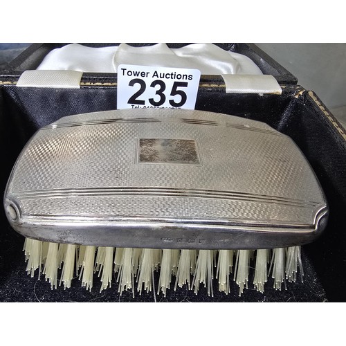 235 - A good quality hallmarked silver backed grooming brush fitted in its original case, the silver brush... 