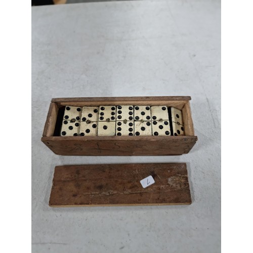 38C - Boxed set of antique hand painted wooden dominoes all with a metal pin in the centre of each domino,... 