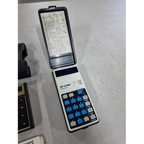 38E - 2x collectable calculators inc a cased Sinclair scientific calculator with red display in full worki... 