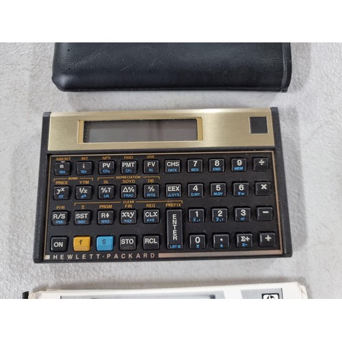 38E - 2x collectable calculators inc a cased Sinclair scientific calculator with red display in full worki... 