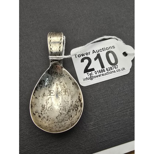 242 - An interesting antique tested as silver Masonic tea caddie spoon marked to the front of spoon E*I NO... 