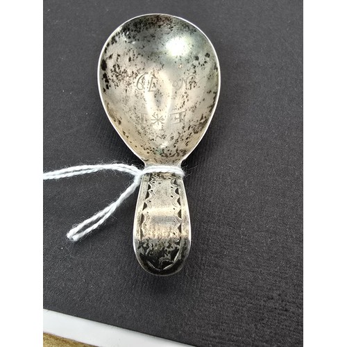 242 - An interesting antique tested as silver Masonic tea caddie spoon marked to the front of spoon E*I NO... 