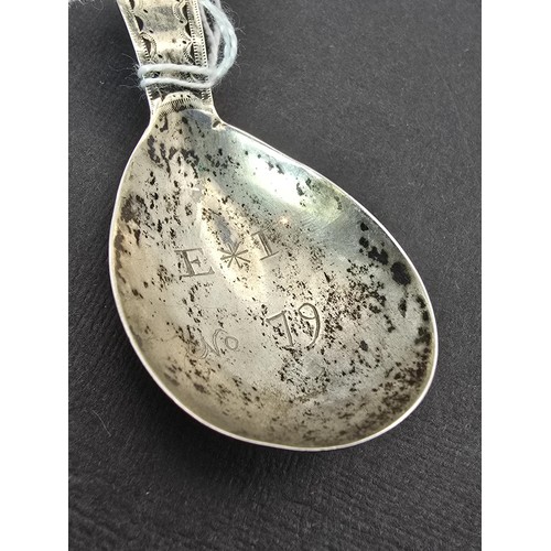 242 - An interesting antique tested as silver Masonic tea caddie spoon marked to the front of spoon E*I NO... 