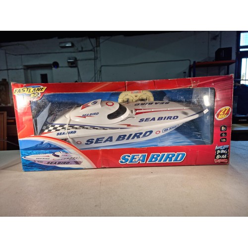 80 - Good quality boxed Sea Bird RC boat complete with remote control by Fast Lane RC. Boat measures 54cm... 