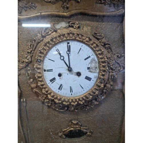 100 - Antique picture frame gilt french clock with floral decoration to the frame in need of restoration c... 