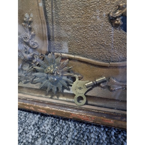 100 - Antique picture frame gilt french clock with floral decoration to the frame in need of restoration c... 