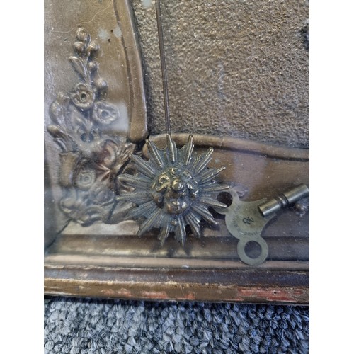 100 - Antique picture frame gilt french clock with floral decoration to the frame in need of restoration c... 