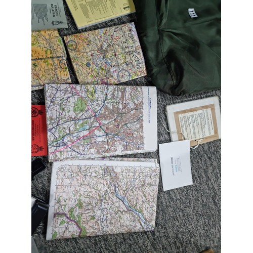 111 - A bag containing a large qty of maps, booklet on familiarization of the cockpit, all relating to the... 