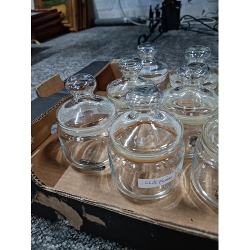 113 - Box containing a qty of 12 glass lidded storage jars all in good order no chips or cracks.