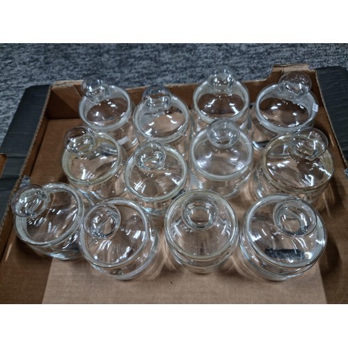 113 - Box containing a qty of 12 glass lidded storage jars all in good order no chips or cracks.