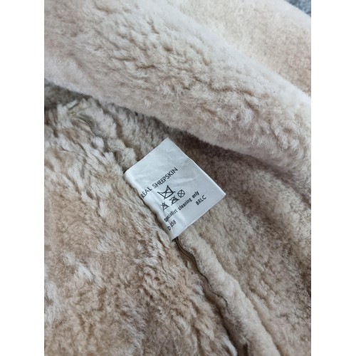 121 - 3x good quality winter coats including 2x sheepskin coats, woollen camel coat. One of the coats is m... 