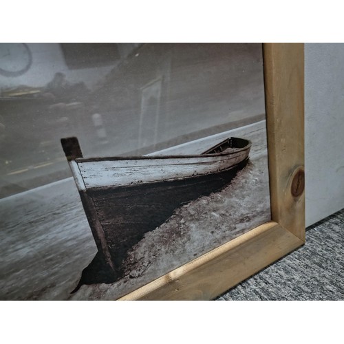 125 - Large frame and glazed photograph of a wooden boat in black and white, frame measures 57cm high by 6... 