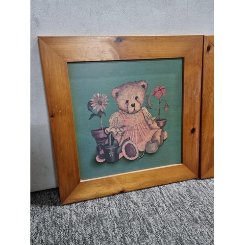 126 - Pair of framed teddy bear prints in good quality wooden frames, each measuring 50cm square