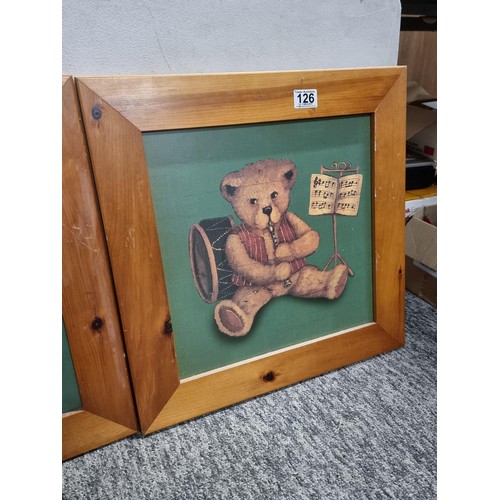 126 - Pair of framed teddy bear prints in good quality wooden frames, each measuring 50cm square