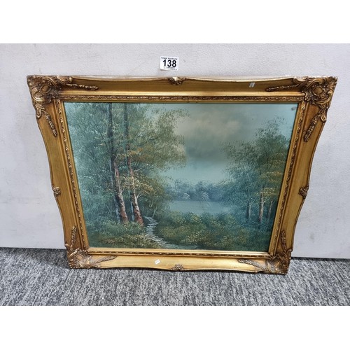 138 - Ornate gilt framed oil on canvas painting of a wooded lake scene inc good order signed lower left Gi... 