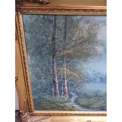 138 - Ornate gilt framed oil on canvas painting of a wooded lake scene inc good order signed lower left Gi... 