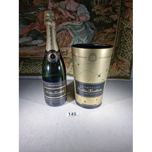 145 - New and sealed bottle of Nicolas Feuillatte Champagne set in a metal champagne bottle with a foam to... 