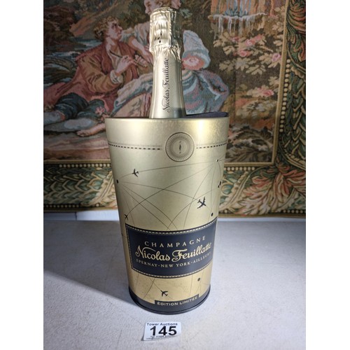 145 - New and sealed bottle of Nicolas Feuillatte Champagne set in a metal champagne bottle with a foam to... 