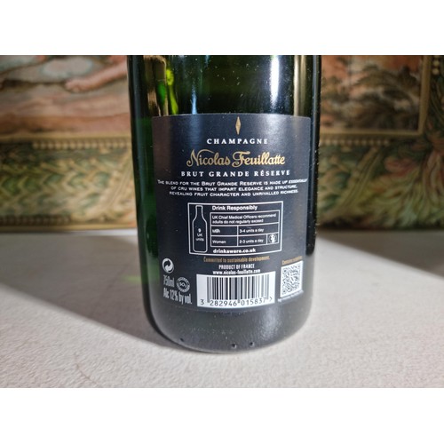 145 - New and sealed bottle of Nicolas Feuillatte Champagne set in a metal champagne bottle with a foam to... 